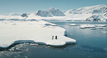 Movie still from “Eurovision Song Contest: The Story of Fire Saga” (2020), directed by David Dobkin – Two people are standing on the ice in the middle of the ocean; Extreme Wide shot, High angle