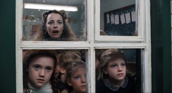 Movie still from “Eurovision Song Contest: The Story of Fire Saga” (2020), directed by David Dobkin – A group of young girls looking out a window; Close Up shot, Low angle