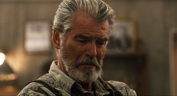 Movie still from “Eurovision Song Contest: The Story of Fire Saga” (2020), directed by David Dobkin – An older man with grey hair and a goatee; Close Up shot, Over the shoulder angle
