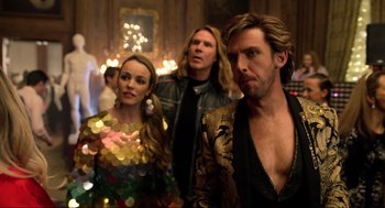 Movie still from “Eurovision Song Contest: The Story of Fire Saga” (2020), directed by David Dobkin – A group of people standing next to each other in a room; Medium shot, Over the shoulder angle