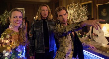 Movie still from “Eurovision Song Contest: The Story of Fire Saga” (2020), directed by David Dobkin – Two men standing next to each other at a party; Medium shot, Over the shoulder angle