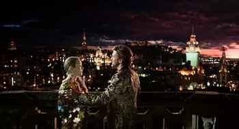 Movie still from “Eurovision Song Contest: The Story of Fire Saga” (2020), directed by David Dobkin – A man and a woman standing next to each other on a balcony; Wide shot, Over the shoulder angle