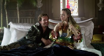 Movie still from “Eurovision Song Contest: The Story of Fire Saga” (2020), directed by David Dobkin – A man and a woman sitting on a bed; Medium shot, Over the shoulder angle