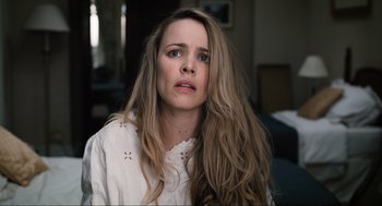 Movie still from “Eurovision Song Contest: The Story of Fire Saga” (2020), directed by David Dobkin – A woman in a white shirt is looking at the camera; Close Up shot, High angle