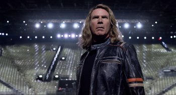 Movie still from “Eurovision Song Contest: The Story of Fire Saga” (2020), directed by David Dobkin – A man with long blonde hair wearing a leather jacket; Close Up shot, Low angle