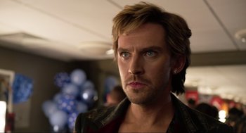 Movie still from “Eurovision Song Contest: The Story of Fire Saga” (2020), directed by David Dobkin – A person wearing a jacket and looking at the camera; Close Up shot, Over the shoulder angle