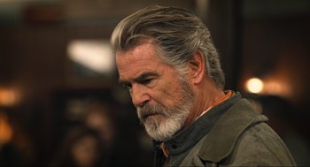 Movie still from “Eurovision Song Contest: The Story of Fire Saga” (2020), directed by David Dobkin – An older man with gray hair and a gray beard; Close Up shot, Over the shoulder angle