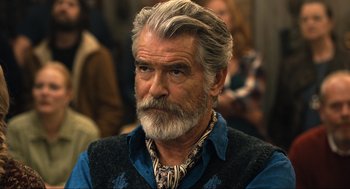Movie still from “Eurovision Song Contest: The Story of Fire Saga” (2020), directed by David Dobkin – An older man with a beard and a mustache; Close Up shot, Over the shoulder angle