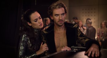 Movie still from “Eurovision Song Contest: The Story of Fire Saga” (2020), directed by David Dobkin – A man and a woman are sitting at a bar; Medium shot, Over the shoulder angle