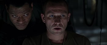 Movie still from “Event Horizon” (1997), directed by Paul W.S. Anderson – A person wearing a necklace; Close Up shot, Over the shoulder angle