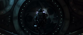 Movie still from “Event Horizon” (1997), directed by Paul W.S. Anderson – A man standing in front of a wall in a dark room; Wide shot, Overhead angle