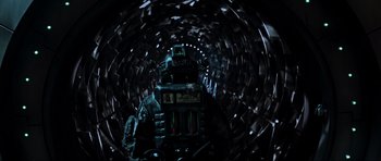 Movie still from “Event Horizon” (1997), directed by Paul W.S. Anderson – A robot in a dark tunnel; Medium shot, Overhead angle