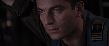 Movie still from “Event Horizon” (1997), directed by Paul W.S. Anderson – A man's face with blue eyes; Close Up shot, Low angle