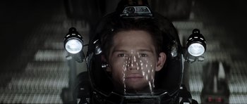 Movie still from “Event Horizon” (1997), directed by Paul W.S. Anderson – A man in a helmet with a light on his head; Close Up shot, Low angle