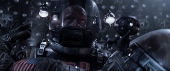 Movie still from “Event Horizon” (1997), directed by Paul W.S. Anderson – A person wearing a space suit; Close Up shot, Overhead angle