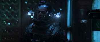 Movie still from “Event Horizon” (1997), directed by Paul W.S. Anderson – A man in a space suit with lights on his head; Medium shot, Over the shoulder angle