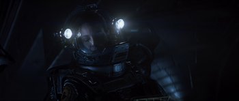 Movie still from “Event Horizon” (1997), directed by Paul W.S. Anderson – A person in a space suit with lights on; Close Up shot, Overhead angle