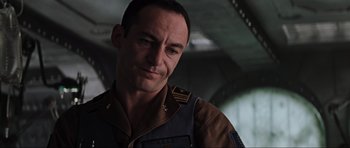 Movie still from “Event Horizon” (1997), directed by Paul W.S. Anderson – A person wearing a military uniform; Close Up shot, Low angle
