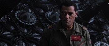 Movie still from “Event Horizon” (1997), directed by Paul W.S. Anderson – A person wearing a uniform; Close Up shot, Low angle