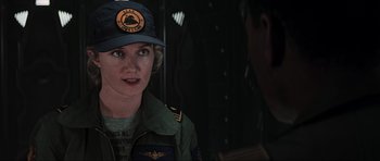 Movie still from “Event Horizon” (1997), directed by Paul W.S. Anderson – A woman wearing a hat and a jacket; Close Up shot, Over the shoulder angle