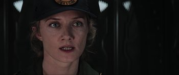 Movie still from “Event Horizon” (1997), directed by Paul W.S. Anderson – A person wearing a hat; Close Up shot, Over the shoulder angle
