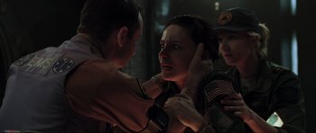 Movie still from “Event Horizon” (1997), directed by Paul W.S. Anderson – A man and a woman are fighting in the dark; Close Up shot, Over the shoulder angle