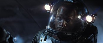 Movie still from “Event Horizon” (1997), directed by Paul W.S. Anderson – A person wearing a space suit; Close Up shot, Overhead angle