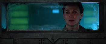 Movie still from “Event Horizon” (1997), directed by Paul W.S. Anderson – A woman looking out of a train window at night; Close Up shot, Over the shoulder angle