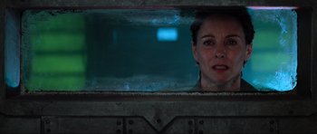 Movie still from “Event Horizon” (1997), directed by Paul W.S. Anderson – A woman looking out of a train window at night; Close Up shot, Low angle