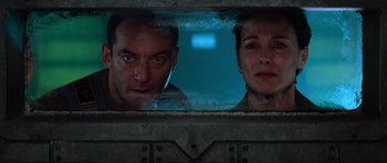 Movie still from “Event Horizon” (1997), directed by Paul W.S. Anderson – A man and a woman looking out of a train window; Close Up shot, Low angle