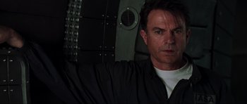 Movie still from “Event Horizon” (1997), directed by Paul W.S. Anderson – A person in a dark room; Close Up shot, Low angle