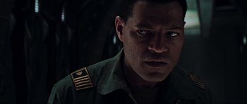 Movie still from “Event Horizon” (1997), directed by Paul W.S. Anderson – A person wearing a military uniform; Close Up shot, High angle
