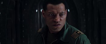 Movie still from “Event Horizon” (1997), directed by Paul W.S. Anderson – A person wearing a uniform; Close Up shot, Low angle