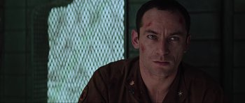 Movie still from “Event Horizon” (1997), directed by Paul W.S. Anderson – A person wearing a brown uniform; Close Up shot, Low angle
