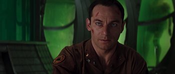Movie still from “Event Horizon” (1997), directed by Paul W.S. Anderson – A person wearing a uniform; Close Up shot, Low angle