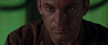 Movie still from “Event Horizon” (1997), directed by Paul W.S. Anderson – A man's face with blood all over his face; Close Up shot, Low angle
