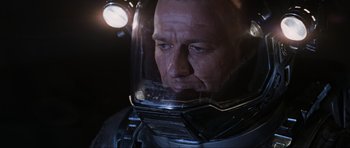 Movie still from “Event Horizon” (1997), directed by Paul W.S. Anderson – A person wearing a helmet; Close Up shot, Over the shoulder angle
