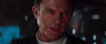 Movie still from “Event Horizon” (1997), directed by Paul W.S. Anderson – A man's face in a dark room; Close Up shot, Low angle