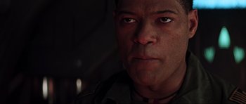 Movie still from “Event Horizon” (1997), directed by Paul W.S. Anderson – A man's face in the dark; Close Up shot, Low angle