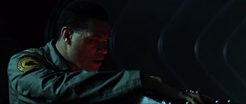 Movie still from “Event Horizon” (1997), directed by Paul W.S. Anderson – A young man is looking into the distance; Close Up shot, Low angle