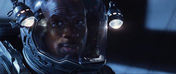 Movie still from “Event Horizon” (1997), directed by Paul W.S. Anderson – A person wearing a helmet; Close Up shot, Overhead angle