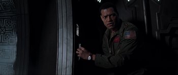 Movie still from “Event Horizon” (1997), directed by Paul W.S. Anderson – A man standing in front of an open door; Close Up shot, Low angle