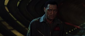 Movie still from “Event Horizon” (1997), directed by Paul W.S. Anderson – A person wearing a uniform; Close Up shot, Over the shoulder angle