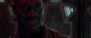 Movie still from “Event Horizon” (1997), directed by Paul W.S. Anderson – A man's face in a dark room; Close Up shot, High angle