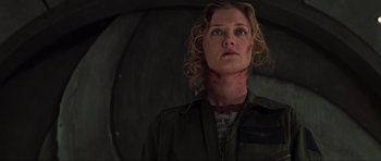 Movie still from “Event Horizon” (1997), directed by Paul W.S. Anderson – A woman in a military uniform looking up at the sky; Close Up shot, Low angle
