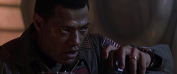 Movie still from “Event Horizon” (1997), directed by Paul W.S. Anderson – A person holding a cell phone; Close Up shot, Low angle