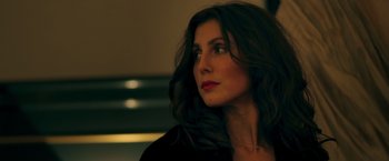 Movie still from “A Taste of Hunger” (2021), directed by Christoffer Boe – A beautiful woman with long dark brown hair and red lipstick; Close Up shot, Low angle