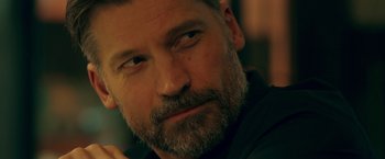 Movie still from “A Taste of Hunger” (2021), directed by Christoffer Boe – A person with a beard; Close Up shot, Over the shoulder angle