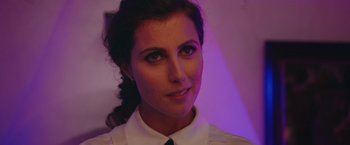 Movie still from “A Taste of Hunger” (2021), directed by Christoffer Boe – A person wearing a shirt and tie; Close Up shot, Over the shoulder angle