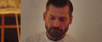 Movie still from “A Taste of Hunger” (2021), directed by Christoffer Boe – A person with a beard; Close Up shot, Low angle